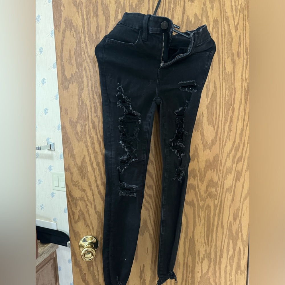 High rise skinny black jeans with holes